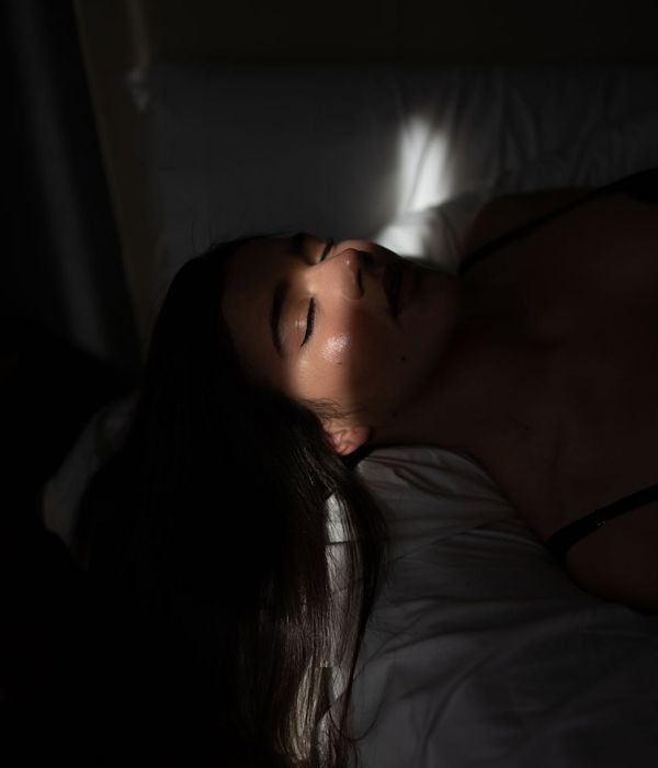 Young woman with closed eyes enjoying peaceful morning light in Ukraine